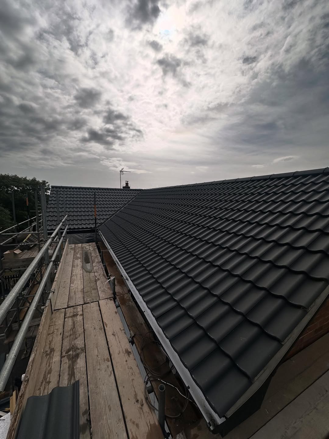 Re - Roof completed in Oulton Broad using new double crest anthracite grey tiles 🔥🧨
